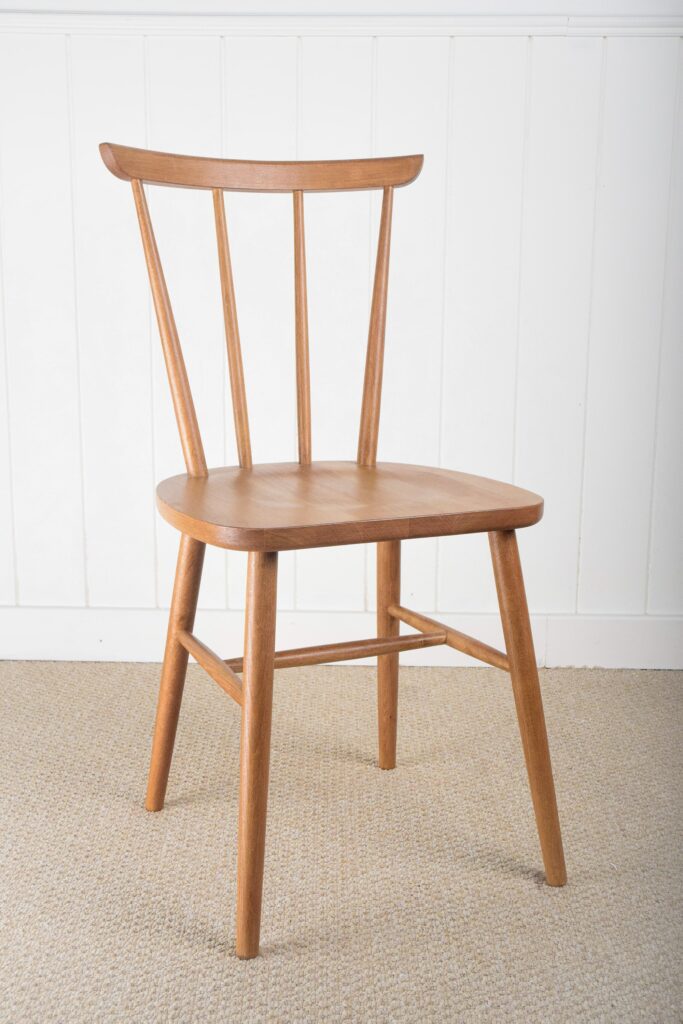 A wooden chair sitting on top of the floor.