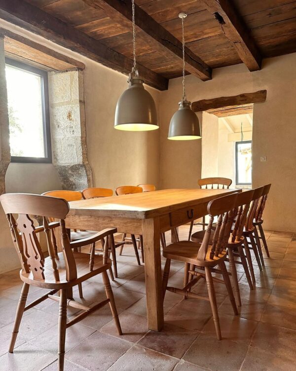 farmhouse chairs around a distressed table in the province of France