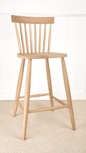 A wooden chair sitting on top of the floor.