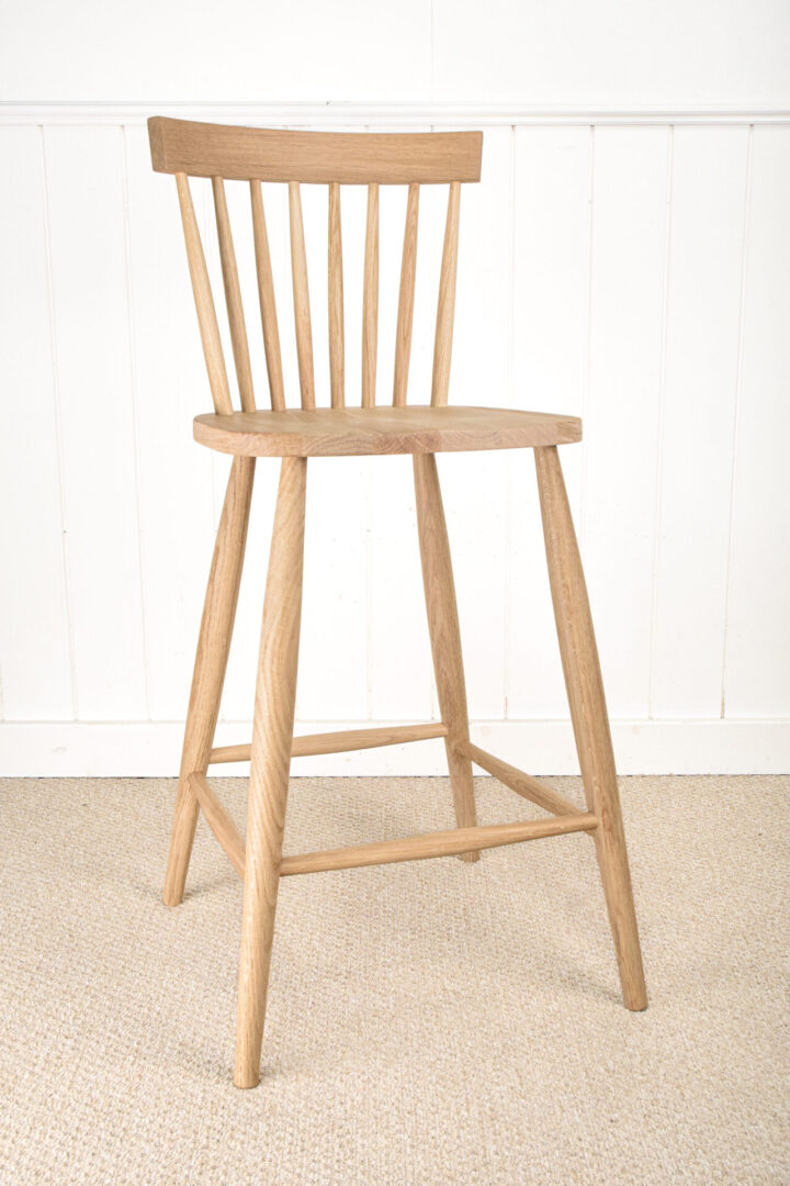 A wooden chair sitting on top of the floor.