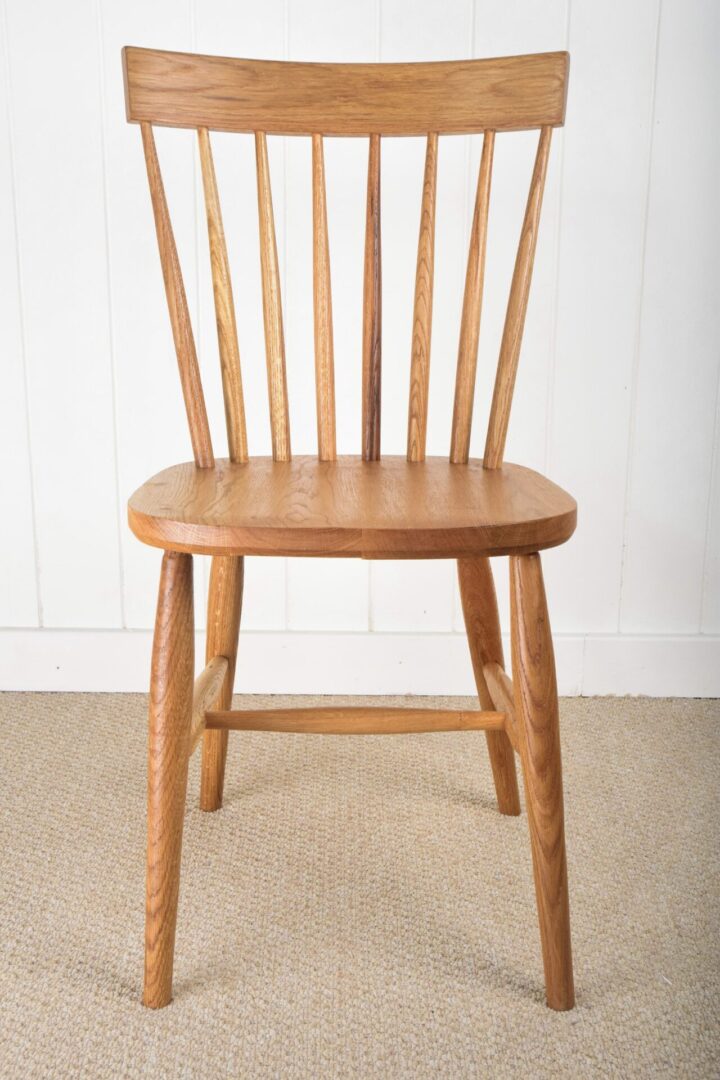 A wooden chair sitting on top of the floor.